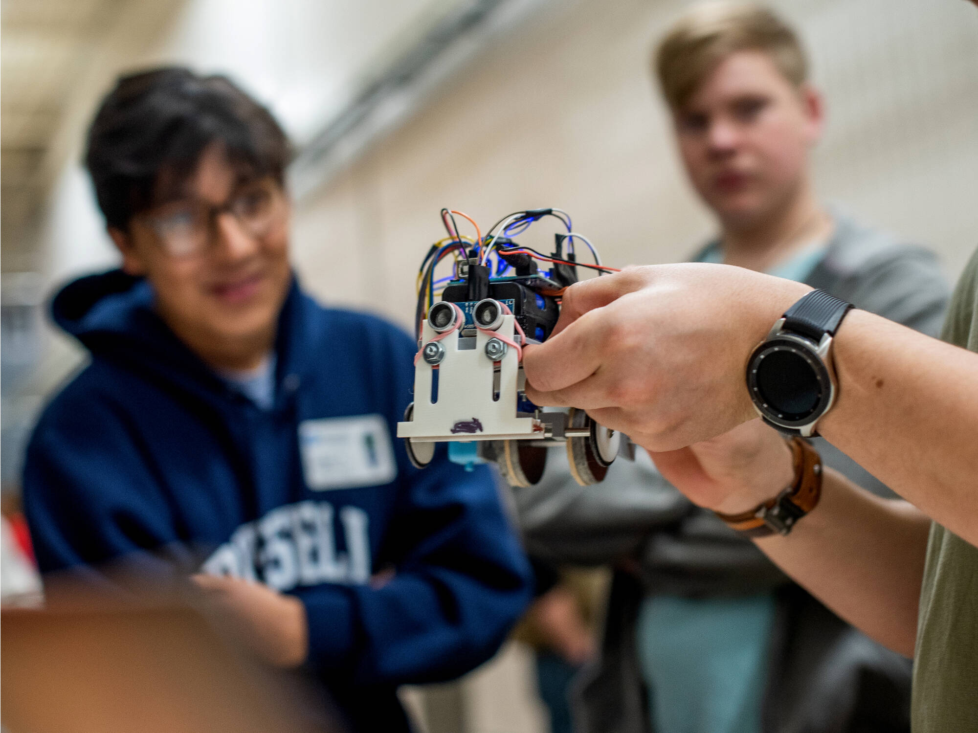 Antonio Santos, a first-year student majoring in product design and manufacturing engineering, talks about at his robot, 'Mark."